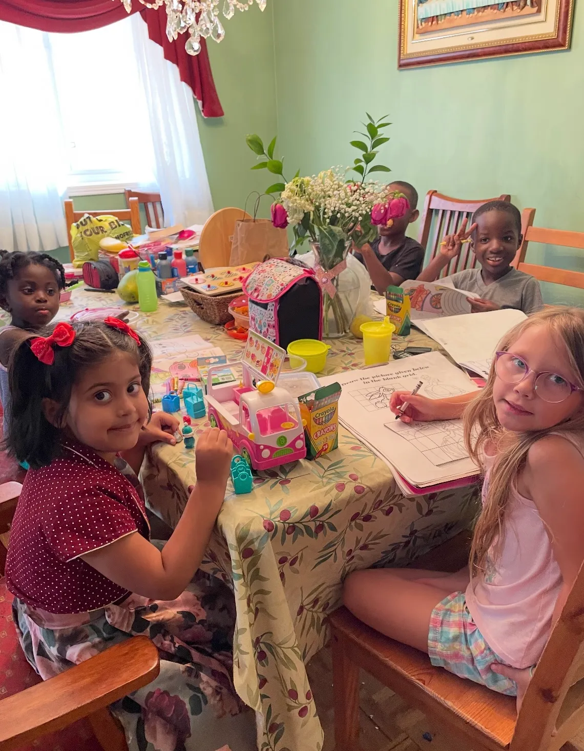 Photo of daycare kids solving math problems